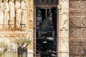 The interior of Notre Dame Cathedral, which suffered a devastating fire April 15, is seen through a doorway April 16. The interior of Notre Dame Cathedral, which suffered a devastating fire April 15, is seen through a doorway April 16.