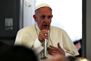 Pope Francis speaks to journalists during a press conference on the papal flight to Rome on July 31. Pope Francis speaks to journalists during a press conference on the papal flight to Rome on July 31.