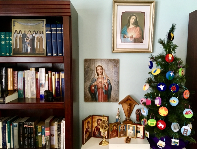 The Spencer family's Jesse tree and Advent wreath are seasonal staples. The Spencer family's Jesse tree and Advent wreath are seasonal staples.
