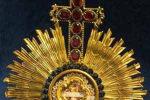 Above, this exquisite reliquary holds a bone fragment of Pope St. Victor I, who died in 199 A.D. Below: The holy card commemorating the ordination of Joseph Ratzinger is shown, along with the slipper of Pope St. Pius X and a papal bull issued by Pope Urban VI, along with artifacts on display. Above, this exquisite reliquary holds a bone fragment of Pope St. Victor I, who died in 199 A.D. Below: The holy card commemorating the ordination of Joseph Ratzinger is shown, along with the slipper of Pope St. Pius X and a papal bull issued by Pope Urban VI, along with artifacts on display.
