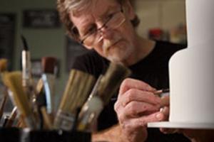 Baker Jack Phillips works on a cake, as his creativity reflects his Christian faith. Baker Jack Phillips works on a cake, as his creativity reflects his Christian faith.