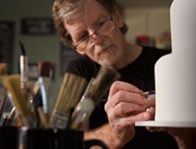 Jack Phillips works on a cake, as his creativity reflects his Christian faith. Jack Phillips works on a cake, as his creativity reflects his Christian faith.