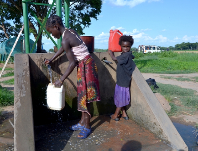 African children fetch water many miles away from home and do not attend school to help their family in Lusaka, Zambia. African children fetch water many miles away from home and do not attend school to help their family in Lusaka, Zambia.