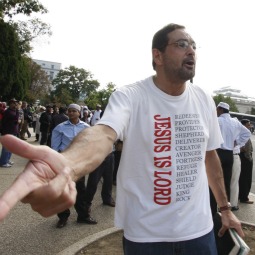 MESSENGER. Evangelist Lazaro Lopez shouts to Muslims to accept Jesus Christ as their lord and savior as they wait for their buses to arrive in Washington Sept. 25, 2009. Nearly 3,000 Muslims from around the United States gathered outside the U.S. Capitol for "jummah," a congregational prayer held on Fridays. A similar encounter in Michigan has led to a lawsuit against the city of Dearborn for its restrictions against an evangelical group.
MESSENGER. Evangelist Lazaro Lopez shouts to Muslims to accept Jesus Christ as their lord and savior as they wait for their buses to arrive in Washington Sept. 25, 2009. Nearly 3,000 Muslims from around the United States gathered outside the U.S. Capitol for "jummah," a congregational prayer held on Fridays. A similar encounter in Michigan has led to a lawsuit against the city of Dearborn for its restrictions against an evangelical group.