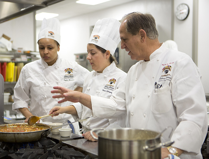 Chef Folse instructs students at the Chef John Folse Culinary Institute Chef Folse instructs students at the Chef John Folse Culinary Institute