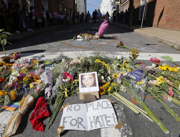 A makeshift memorial of flowers and a photo of victim Heather Heyer sits in Charlottesville, Virginia, Aug. 13. Heyer died when a car rammed into a group of people who were protesting the presence of white supremacists who had gathered in the city for a rally. A makeshift memorial of flowers and a photo of victim Heather Heyer sits in Charlottesville, Virginia, Aug. 13. Heyer died when a car rammed into a group of people who were protesting the presence of white supremacists who had gathered in the city for a rally.