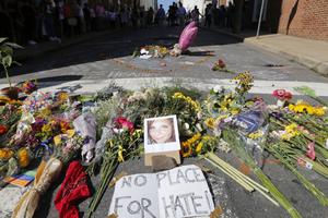 A makeshift memorial of flowers and a photo of victim Heather Heyer sits in Charlottesville, Virginia, Aug. 13. Heyer died when a car rammed into a group of people who were protesting the presence of white supremacists who had gathered in the city for a rally. A makeshift memorial of flowers and a photo of victim Heather Heyer sits in Charlottesville, Virginia, Aug. 13. Heyer died when a car rammed into a group of people who were protesting the presence of white supremacists who had gathered in the city for a rally.
