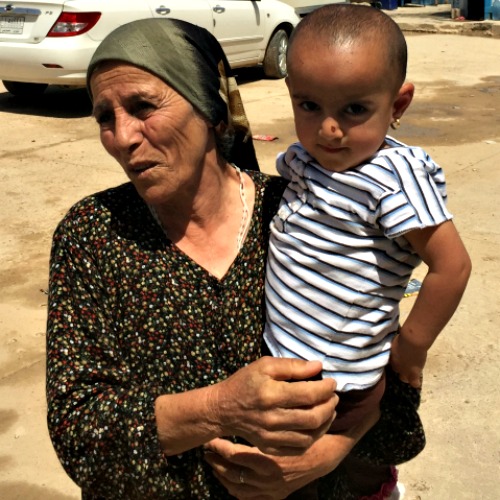 An woman and child at a refugee camp in Erbil, Iraq. The woman claims her husband was kidnapped by the Islamic State group. Below, Father Benedict Kiely of the Diocese of Burlington, Vt., with a group of Dominican nuns who minister to Iraqi refugees, and Christian refugees make do at one of the camps. An woman and child at a refugee camp in Erbil, Iraq. The woman claims her husband was kidnapped by the Islamic State group. Below, Father Benedict Kiely of the Diocese of Burlington, Vt., with a group of Dominican nuns who minister to Iraqi refugees, and Christian refugees make do at one of the camps.