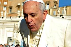 Pope Francis blows out candles on a cake for his 78th birthday in St. Peter’s Square during his Wednesday general audience on Dec. 17. Pope Francis blows out candles on a cake for his 78th birthday in St. Peter’s Square during his Wednesday general audience on Dec. 17.