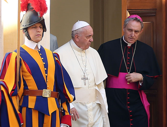 Pope Francis and Archbishop Georg Gänswein arrive at the Paul VI Hall on May 10, 2015 in Vatican City.
Pope Francis and Archbishop Georg Gänswein arrive at the Paul VI Hall on May 10, 2015 in Vatican City.