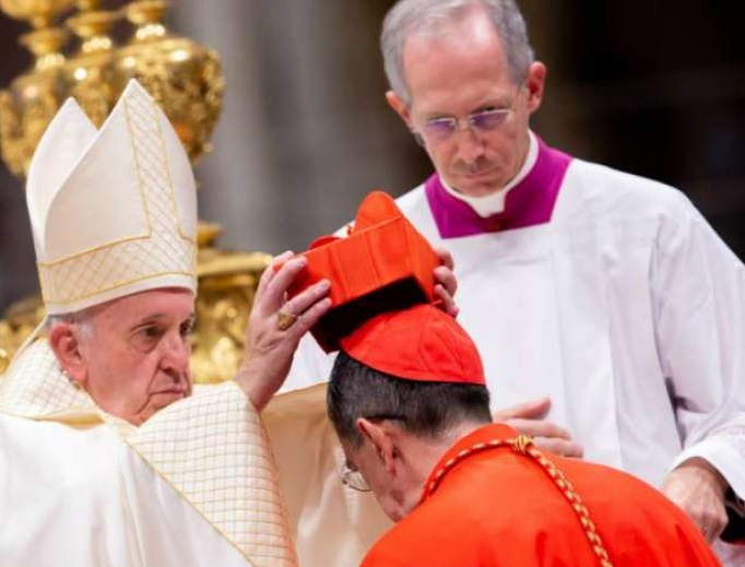 Pope Francis places the red biretta on Cardinal Miguel Ángel Ayuso Guixot Oct. 5. Pope Francis places the red biretta on Cardinal Miguel Ángel Ayuso Guixot Oct. 5.