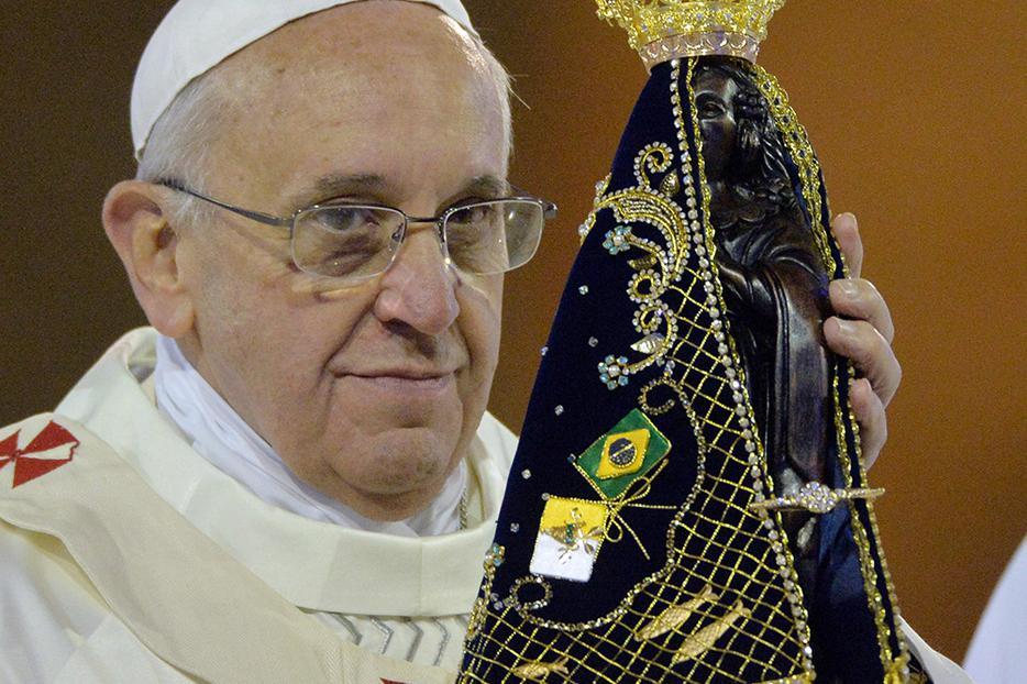 Pope Francis holds the statue of Our Lady of Aparecida at Brazil’s National Shrine of Our Lady of Aparecida on July 24, 2013.
Pope Francis holds the statue of Our Lady of Aparecida at Brazil’s National Shrine of Our Lady of Aparecida on July 24, 2013.