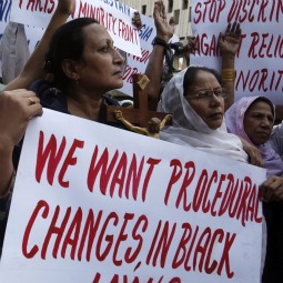 Protesters hold up placards while demanding the release of Asia Bibi, a Pakistani Christian woman who has been sentenced to death for blasphemy, at a rally in Karachi Nov. 25. Pakistan President Asif Ali Zardari may not have the political strength needed to abolish the anti-blasphemy law that places Christians at risk, but he promised to try to revise the law, said Cardinal Jean-Louis Tauran. Protesters hold up placards while demanding the release of Asia Bibi, a Pakistani Christian woman who has been sentenced to death for blasphemy, at a rally in Karachi Nov. 25. Pakistan President Asif Ali Zardari may not have the political strength needed to abolish the anti-blasphemy law that places Christians at risk, but he promised to try to revise the law, said Cardinal Jean-Louis Tauran.