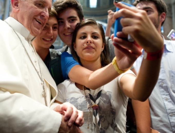 Pope Francis and youth take a selfie. Pope Francis and youth take a selfie.