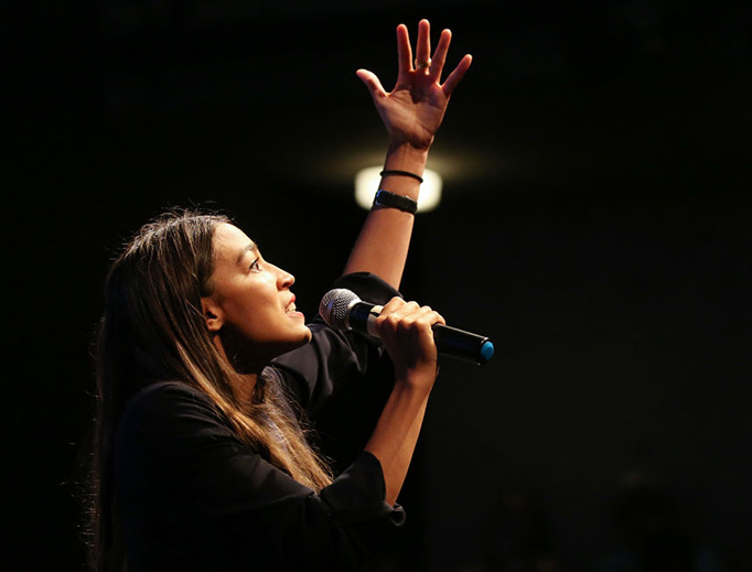 U.S. House candidate Alexandria Ocasio-Cortez (D-NY) speaks at a fundraiser on Aug. 2, 2018 in Los Angeles, California. The rising political star may become the youngest woman elected to Congress this November when she will be 29 years old. U.S. House candidate Alexandria Ocasio-Cortez (D-NY) speaks at a fundraiser on Aug. 2, 2018 in Los Angeles, California. The rising political star may become the youngest woman elected to Congress this November when she will be 29 years old.