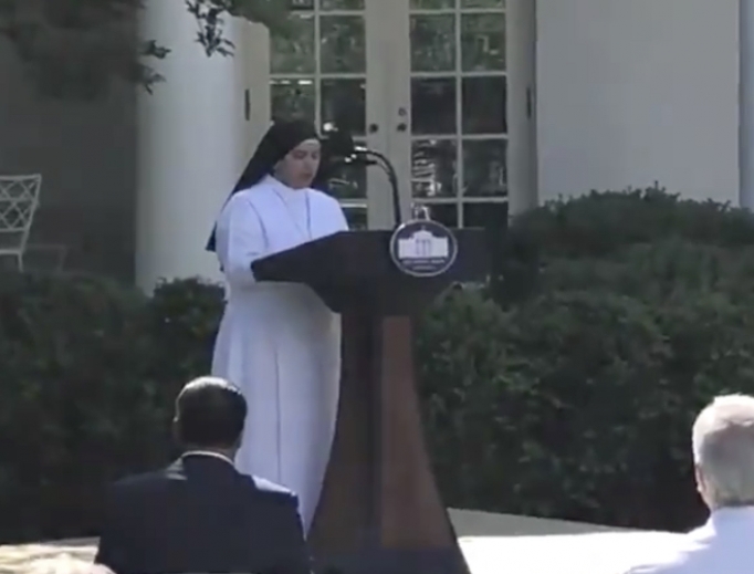 Sister Eneyda Martinez of the Poor Sisters of St. Joseph community offers a prayer from the White House lawn. Sister Eneyda Martinez of the Poor Sisters of St. Joseph community offers a prayer from the White House lawn.