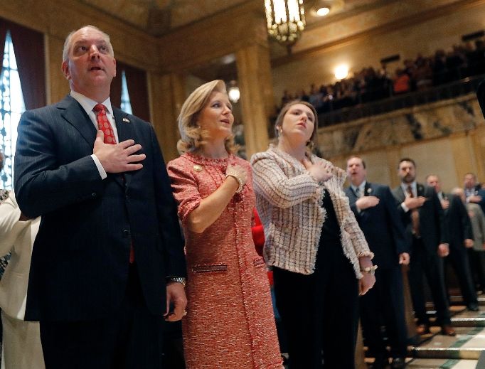 Louisiana Gov. John Bel Edwards holds his hand to his heart, along with his wife, Donna Edwards, and their daughter Sarah Ellen Edwards, right, during the pledge of allegiance at the opening of the annual state legislative session in Baton Rouge on April 8. Nearly three decades ago, when Mrs. Edwards was 20 weeks pregnant with their first child, a doctor discovered their daughter had spina bifida and encouraged an abortion. The Edwardses refused. Edwards, who has repeatedly bucked national party leaders on abortion rights, signed legislation that would ban the procedure as early as six weeks of pregnancy. Louisiana Gov. John Bel Edwards holds his hand to his heart, along with his wife, Donna Edwards, and their daughter Sarah Ellen Edwards, right, during the pledge of allegiance at the opening of the annual state legislative session in Baton Rouge on April 8. Nearly three decades ago, when Mrs. Edwards was 20 weeks pregnant with their first child, a doctor discovered their daughter had spina bifida and encouraged an abortion. The Edwardses refused. Edwards, who has repeatedly bucked national party leaders on abortion rights, signed legislation that would ban the procedure as early as six weeks of pregnancy.