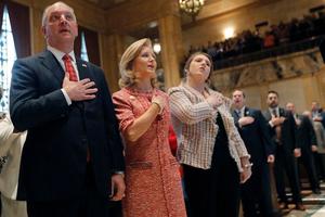 Louisiana Gov. John Bel Edwards holds his hand to his heart, along with his wife, Donna Edwards, and their daughter Sarah Ellen Edwards, right, during the pledge of allegiance at the opening of the annual state legislative session in Baton Rouge on April 8. Nearly three decades ago, when Mrs. Edwards was 20 weeks pregnant with their first child, a doctor discovered their daughter had spina bifida and encouraged an abortion. The Edwardses refused. Edwards, who has repeatedly bucked national party leaders on abortion rights, signed legislation that would ban the procedure as early as six weeks of pregnancy. Louisiana Gov. John Bel Edwards holds his hand to his heart, along with his wife, Donna Edwards, and their daughter Sarah Ellen Edwards, right, during the pledge of allegiance at the opening of the annual state legislative session in Baton Rouge on April 8. Nearly three decades ago, when Mrs. Edwards was 20 weeks pregnant with their first child, a doctor discovered their daughter had spina bifida and encouraged an abortion. The Edwardses refused. Edwards, who has repeatedly bucked national party leaders on abortion rights, signed legislation that would ban the procedure as early as six weeks of pregnancy.