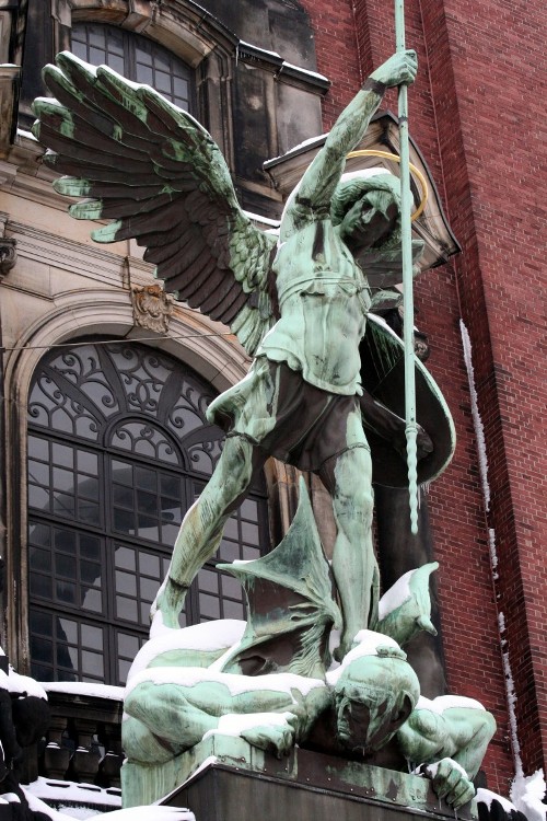Statue of St. Michael defeating the devil in Hamburg, Germany Statue of St. Michael defeating the devil in Hamburg, Germany