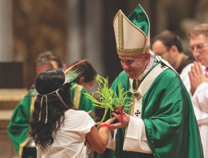 Pope Francis accepts a gift at the Mass for the closing of the Amazon synod Oct. 27.
Pope Francis accepts a gift at the Mass for the closing of the Amazon synod Oct. 27.