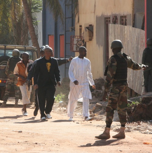 People flee from a Nov. 20 terrorist attack at the Radisson Blu Hotel in Bamako, Mali. The government of the former French colony has been fighting against Islamic extremists with the assistance of French forces since 2013. People flee from a Nov. 20 terrorist attack at the Radisson Blu Hotel in Bamako, Mali. The government of the former French colony has been fighting against Islamic extremists with the assistance of French forces since 2013.