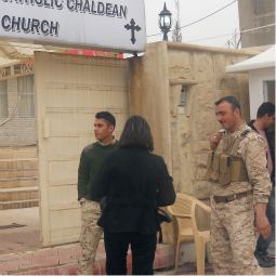 Armed guards inspect people as they enter St. Joseph Chaldean Catholic Church in Sulaimani, Iraq, Feb. 26. The community is home to a large number of the 1,300 Christians families who fled north after the bombing of a Syrian Catholic church in Baghdad in November. Armed guards inspect people as they enter St. Joseph Chaldean Catholic Church in Sulaimani, Iraq, Feb. 26. The community is home to a large number of the 1,300 Christians families who fled north after the bombing of a Syrian Catholic church in Baghdad in November.