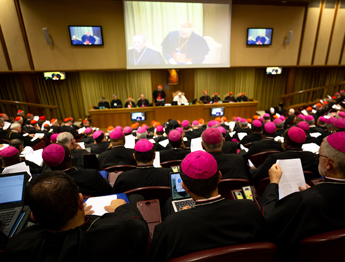 Pope Francis leads the introductory prayer and delivers his greeting on the opening day of the 15th Ordinary General Assembly of the Synod of Bishops in the Vatican Synod Hall on Oct. 3, 2018. Pope Francis leads the introductory prayer and delivers his greeting on the opening day of the 15th Ordinary General Assembly of the Synod of Bishops in the Vatican Synod Hall on Oct. 3, 2018.