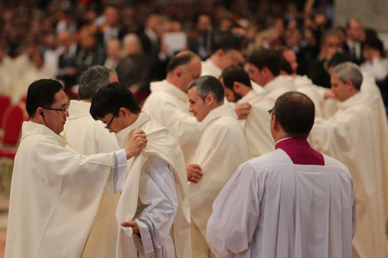 New priests are clothed with chasubles during their ordination Mass in St. Peter’s Basilica April 26, 2015. New priests are clothed with chasubles during their ordination Mass in St. Peter’s Basilica April 26, 2015.