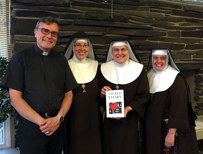 Father Bill Watson, shown with Poor Clares of Perpetual Adoration from the Monastery of St. Michael the Archangel, and his Sacred Story Institute promote Ignatian spirituality. Father Bill Watson, shown with Poor Clares of Perpetual Adoration from the Monastery of St. Michael the Archangel, and his Sacred Story Institute promote Ignatian spirituality.