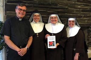 Father Bill Watson, shown with Poor Clares of Perpetual Adoration from the Monastery of St. Michael the Archangel, and his Sacred Story Institute promote Ignatian spirituality. Father Bill Watson, shown with Poor Clares of Perpetual Adoration from the Monastery of St. Michael the Archangel, and his Sacred Story Institute promote Ignatian spirituality.