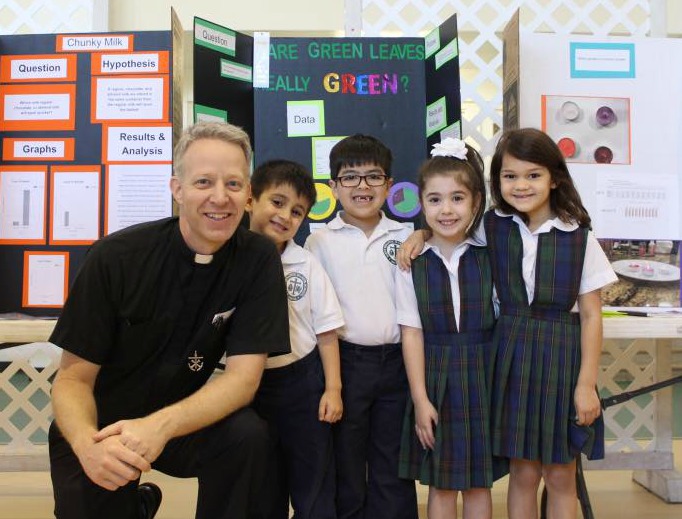 Father William Wack with students at St. Ignatius Martyr school in Austin, Texas. Father William Wack with students at St. Ignatius Martyr school in Austin, Texas.