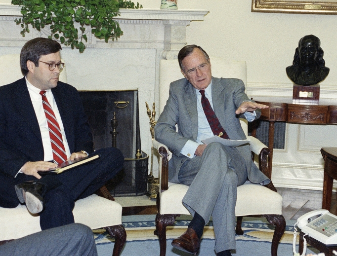 U.S. President George H. Bush gestures while talking to Attorney General William Barr in the Oval Office of the White House May 4, 1992, in Washington. The president met with top domestic cabinet officers to tackle long-range problems pushed to the forefront by the deadly riots in Los Angeles. U.S. President George H. Bush gestures while talking to Attorney General William Barr in the Oval Office of the White House May 4, 1992, in Washington. The president met with top domestic cabinet officers to tackle long-range problems pushed to the forefront by the deadly riots in Los Angeles.