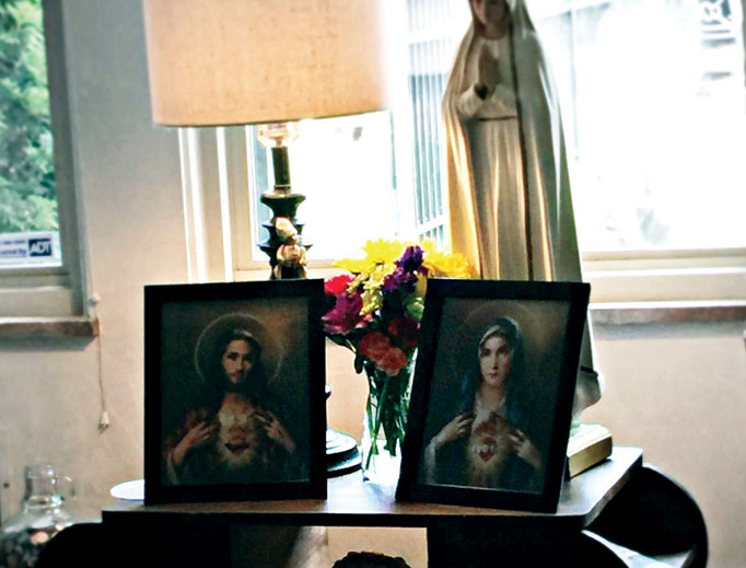 The Sacred Heart and Immaculate Heart images have pride of place in the Wilson home. The Sacred Heart and Immaculate Heart images have pride of place in the Wilson home.
