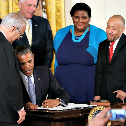 U.S. President Barack Obama signs an executive order on workplace discrimination July 21 at the White House in Washington. The executive order bars workplace discrimination in the federal government and its contracting agencies on the basis of sexual orientation and gender identity. U.S. President Barack Obama signs an executive order on workplace discrimination July 21 at the White House in Washington. The executive order bars workplace discrimination in the federal government and its contracting agencies on the basis of sexual orientation and gender identity.