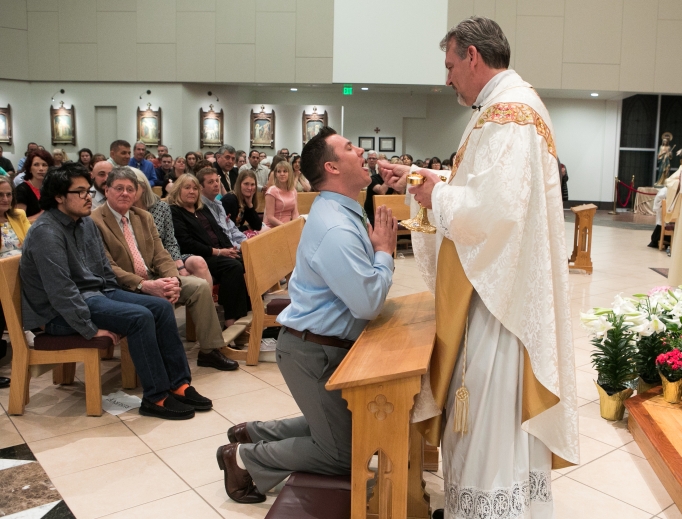 Tanner Rogers receives first Holy Communion at the Easter vigil 2019. Tanner Rogers receives first Holy Communion at the Easter vigil 2019.