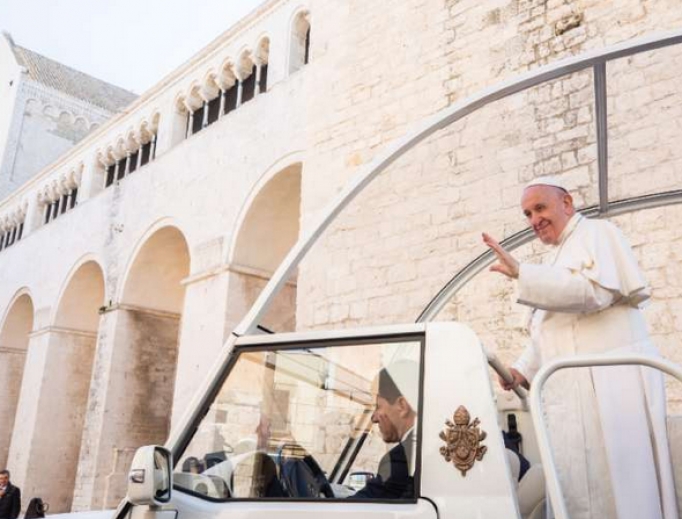 Pope Francis waves from the popemobile in Bari, Italy Feb. 23. Pope Francis waves from the popemobile in Bari, Italy Feb. 23.