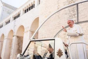 Pope Francis waves from the popemobile in Bari, Italy Feb. 23. Pope Francis waves from the popemobile in Bari, Italy Feb. 23.