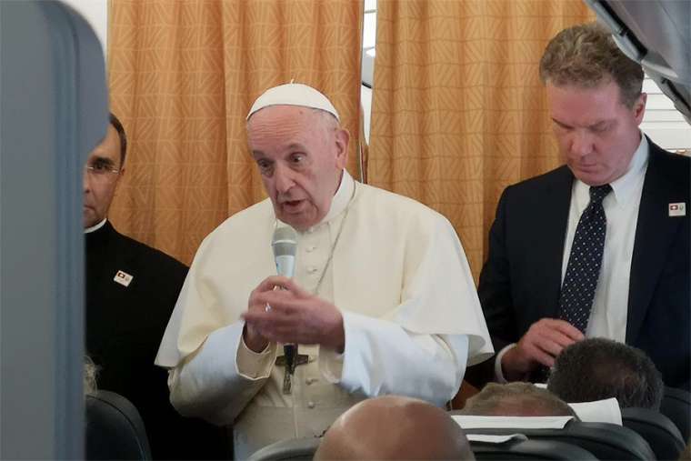 Pope Francis on the return flight from his trip to Geneva, Switzerland, June 21. Pope Francis on the return flight from his trip to Geneva, Switzerland, June 21.