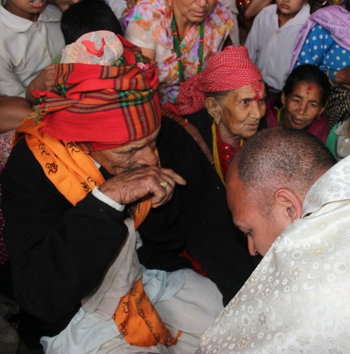 Jesuit Father Tek Raj Paudel kneels before his parents, Indra Bahadur Paudel and Uttra Kumari, during his April 25 ordination Mass in the Nepalese village of Tarkerabari. Jesuit Father Tek Raj Paudel kneels before his parents, Indra Bahadur Paudel and Uttra Kumari, during his April 25 ordination Mass in the Nepalese village of Tarkerabari.