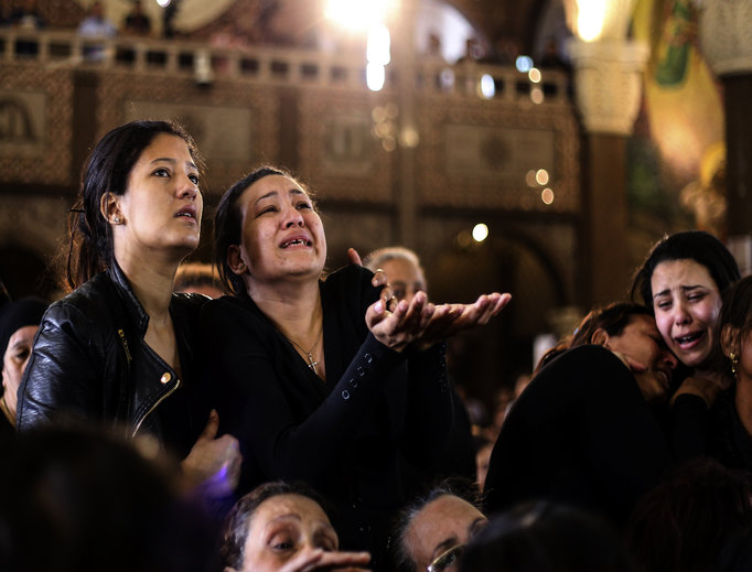 Women cry during the April 10 funeral for those killed in a Palm Sunday church attack in Alexandria, Egypt, at the Mar Amina Church. Egyptian Christians were burying their dead on Monday, a day after Islamic State suicide bombers killed at least 45 people in coordinated attacks targeting Palm Sunday services in two cities. Women wailed as caskets marked with the word ‘martyr’ were brought into the church in the coastal city of Alexandria, the footage broadcast on several Egyptian channels. Women cry during the April 10 funeral for those killed in a Palm Sunday church attack in Alexandria, Egypt, at the Mar Amina Church. Egyptian Christians were burying their dead on Monday, a day after Islamic State suicide bombers killed at least 45 people in coordinated attacks targeting Palm Sunday services in two cities. Women wailed as caskets marked with the word ‘martyr’ were brought into the church in the coastal city of Alexandria, the footage broadcast on several Egyptian channels.