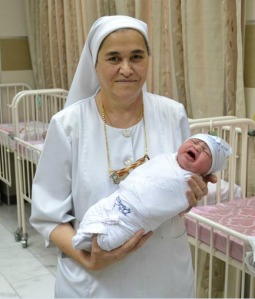 Sister Bushra Farach holds a newborn baby at the Dominican-run Al Hayaat maternity hospital in Baghdad, Iraq. Sister Bushra Farach holds a newborn baby at the Dominican-run Al Hayaat maternity hospital in Baghdad, Iraq.