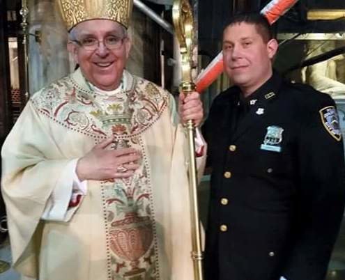 Officer Charlie Carroll with Bishop John O'Hara, auxiliary bishop of the Archdiocese of New York.
Officer Charlie Carroll with Bishop John O'Hara, auxiliary bishop of the Archdiocese of New York.