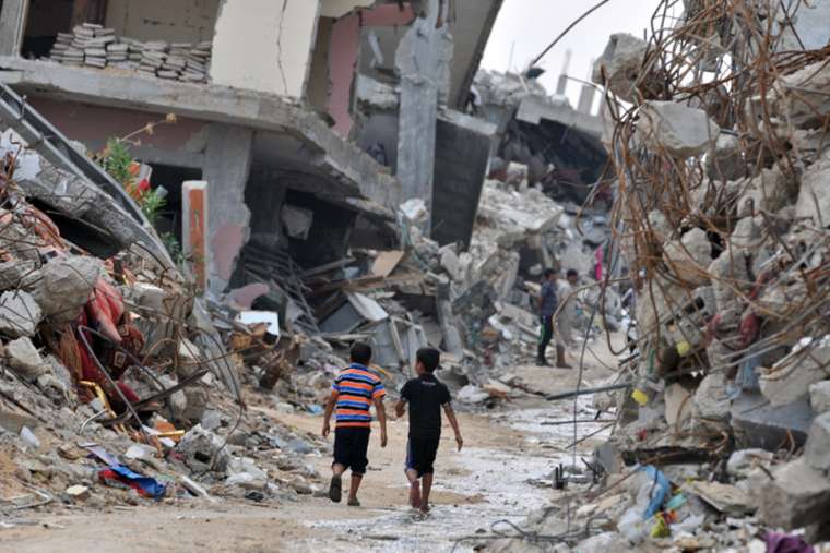 Children amid devastated buildings in Gaza. Children amid devastated buildings in Gaza.
