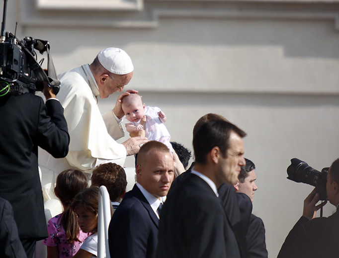 Pope Francis blesses a baby at the general audience in St. Peter's Square on Aug. 30, 2017.
Pope Francis blesses a baby at the general audience in St. Peter's Square on Aug. 30, 2017.
