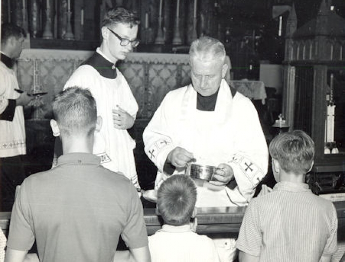 Father Walter Ciszek distributes Communion at Mass in the 1960s. Father Walter Ciszek distributes Communion at Mass in the 1960s.