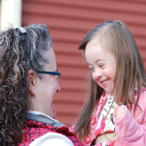 Above, Shelly Lichty and daughter Elizabeth share a smile; below, the Scofields, Shaws and Lichtys with their extra-special daughters. Above, Shelly Lichty and daughter Elizabeth share a smile; below, the Scofields, Shaws and Lichtys with their extra-special daughters.