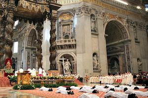 Nineteen men lie prostrate for their ordination as priests for the Diocese of Rome on April 26. Nineteen men lie prostrate for their ordination as priests for the Diocese of Rome on April 26.
