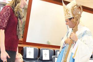 The Ave Maria Academy chapel dedication brought families out for prayer. The Ave Maria Academy chapel dedication brought families out for prayer.