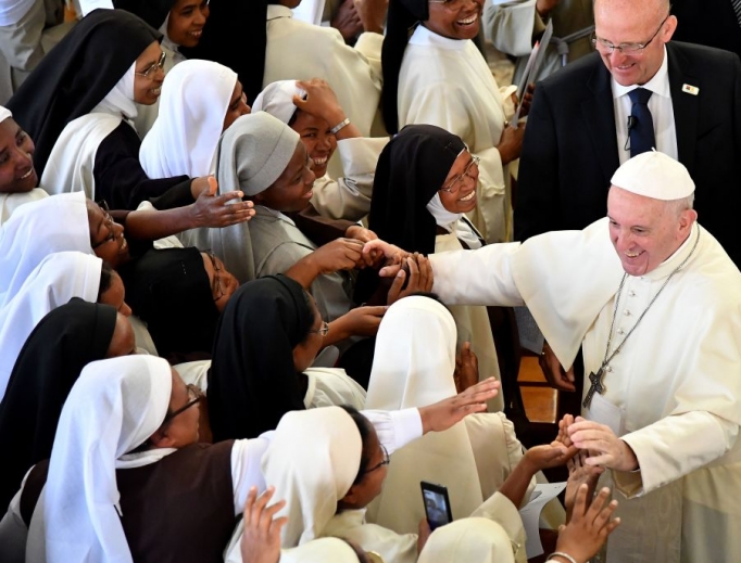 Pope Francis' shakes hands with nuns at the end of morning prayer at the Monastery of the Discalced Carmelites in Antananarivo, Madagascar, on Sept. 7. Pope Francis' shakes hands with nuns at the end of morning prayer at the Monastery of the Discalced Carmelites in Antananarivo, Madagascar, on Sept. 7.