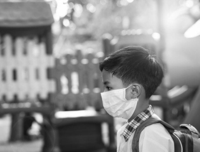 A 5-year old boy wears a face mask amid the coronavirus pandemic. A 5-year old boy wears a face mask amid the coronavirus pandemic.